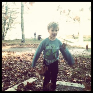 Sean playing with leaves